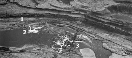 This 1940s aerial view shows the falls and railroad bridge, looking south