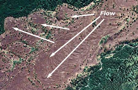 Aerial views show giant ripples and lobes in the Parkdale lava flow, and the displaced Middle Fork Hood River, flowing along the edge of the new lava