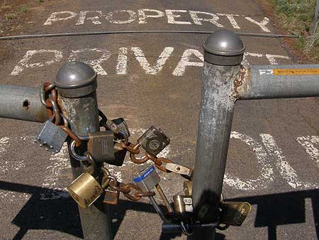 Trophy home gate on Hood River Mountain, where high anxiety accompanies country living for these dream-home dwellers.