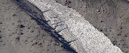 A close-up view of the mini-glaciers reveals classic crevasses