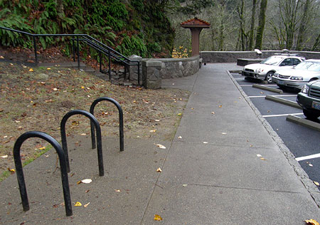 Centrally located bike racks front the main parking area