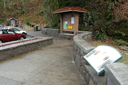 The view toward the visitor signboard and steps leading to the upper falls viewpoint from the new plaza (interpretive sign in foreground)