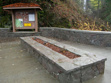 A large planter bench anchors the new plaza
