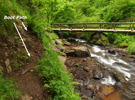 Looking back at the footbridge, and the extent of damage from the boot path