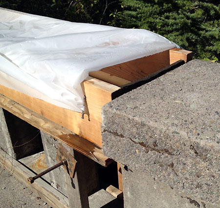 Close-up view of the wood forms constructed for the new railing cap