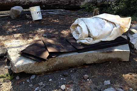 Crews saved this piece of the old fountain footing -- perhaps to be repurposed as a bench?