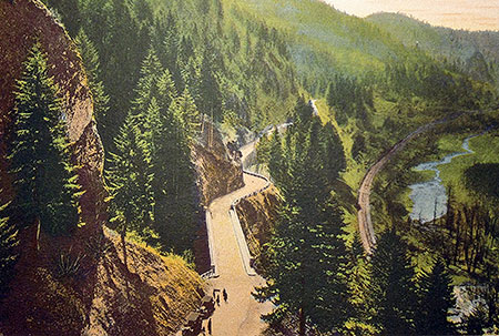 This unusual hand-colored photo from the 1920s is from the Bishops Cap, looking west toward the bridge at Shepperd's Dell. Though the trees have grown, much of the rest of this scene is preserved today.
