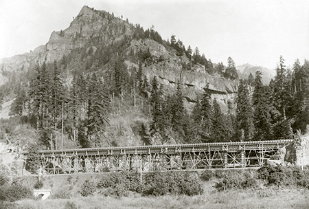 Columbia River Highway bridge at McCord Creek under construction in 1915 (Wauneka Point towers above)