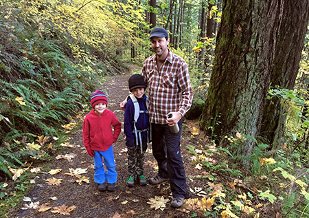 A young family enjoying the McCord Creek Trail in late autumn
