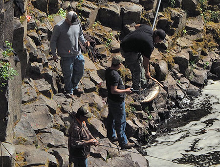 Tribal fishermen at Punchbowl Falls