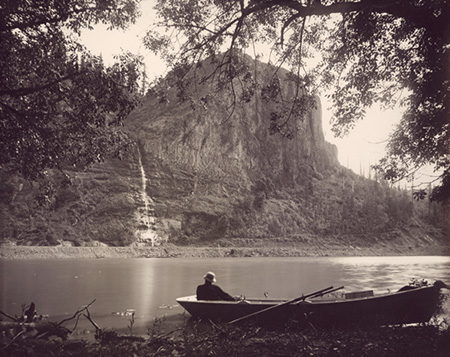 "Palisades, Columbia River" This 1880s scene captured by Frank J. Haynes, official photographer for the Union Pacific Railroad. Crown Point (then called "Thor's Heights") and its lacy waterfall are the backdrop for what was known as Echo Bay in the early days of settlement.