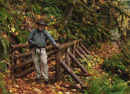 The author ankle-deep in maple leaves on the Butte Creek Trail